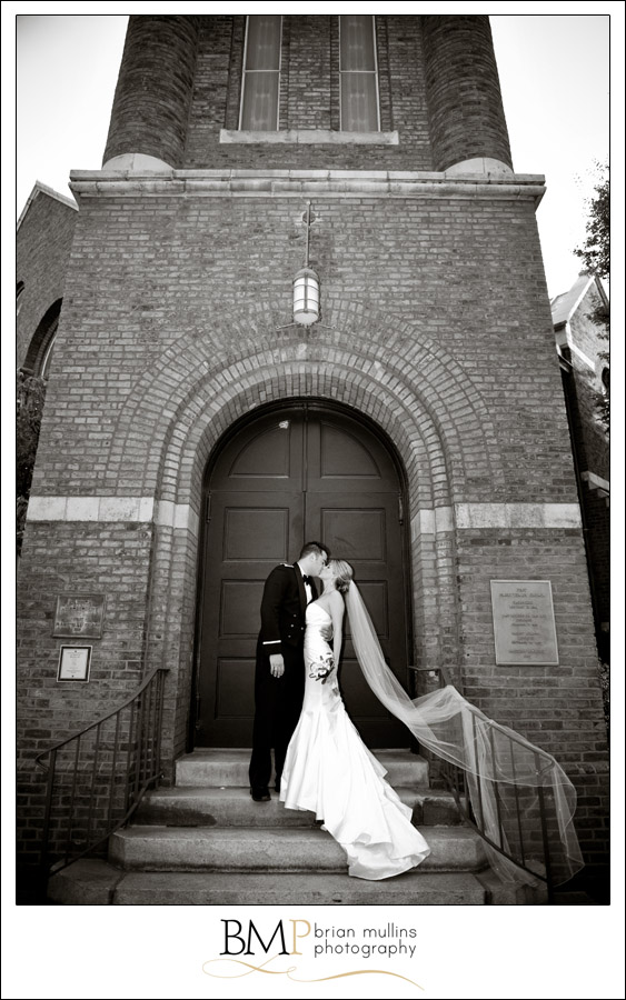 Photography of Raleigh wedding couple kissing in downtown