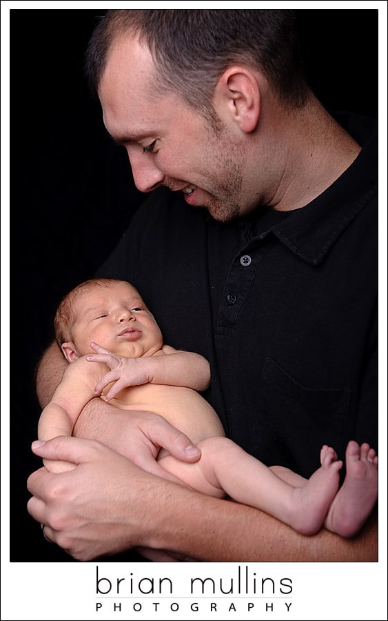 daddy and baby on black