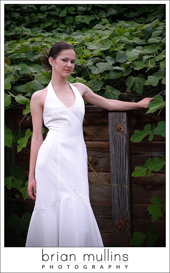 Bride in front of railroad trestle