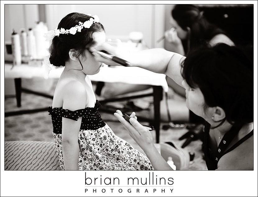flower girl getting her makeup done