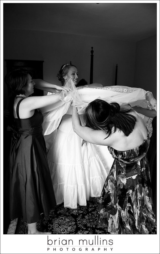 Bride putting on wedding dress - Raleigh Wedding Photographer Bride putting on wedding dress - Raleigh Wedding Photographer