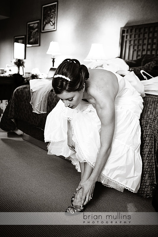 bride putting on shoes - Grove Park Inn Asheville, NC Wedding Photography