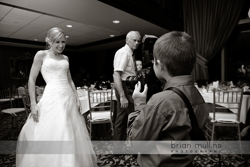 wedding guest with wedding photographers camera wedding guest with wedding photographers camera