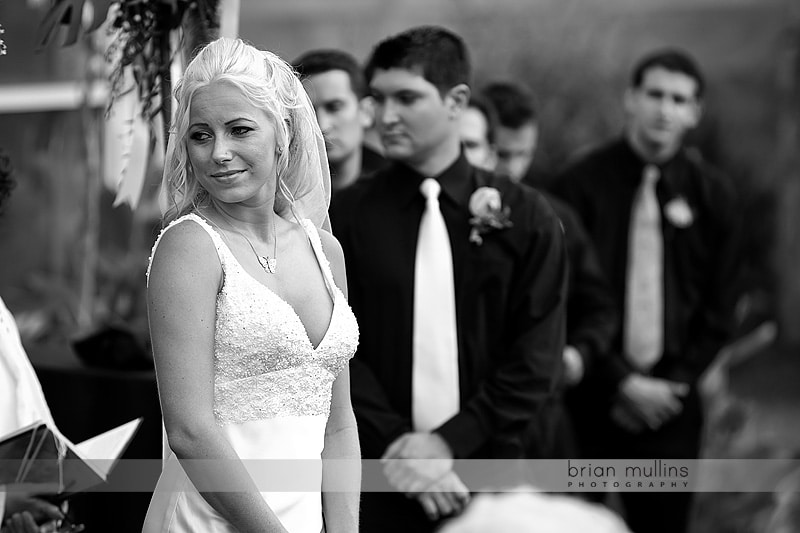 bride wathcing sister playing violin at wedding