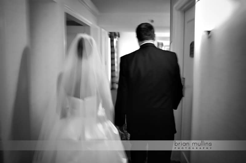 bride walking with father before wedding