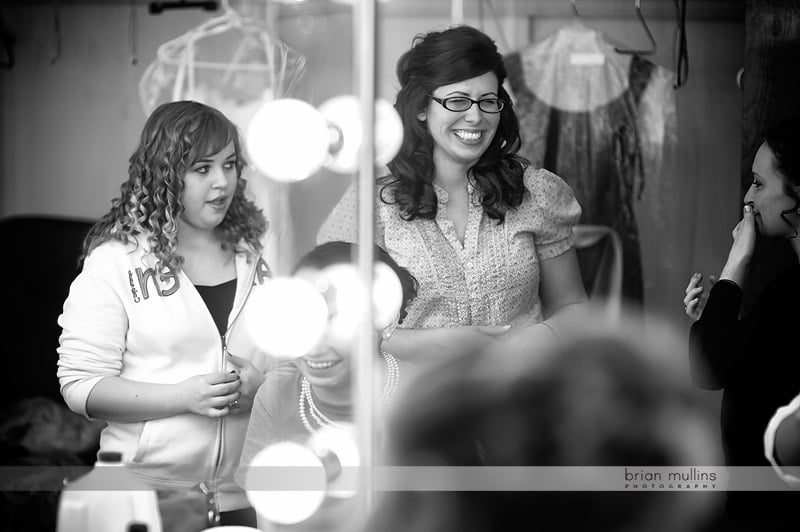 bride getting ready at the fair barn