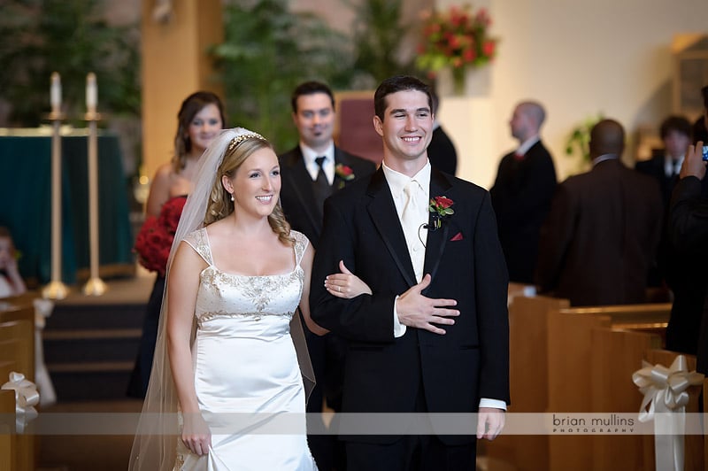 bride and groom walking down aisle