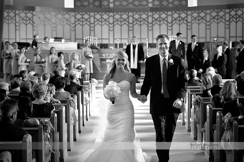 bride and groom walking down aisle