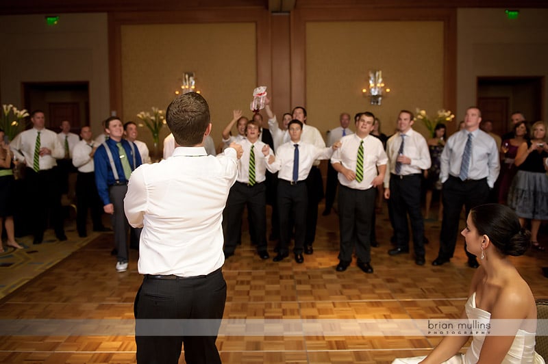 groom tossing garter