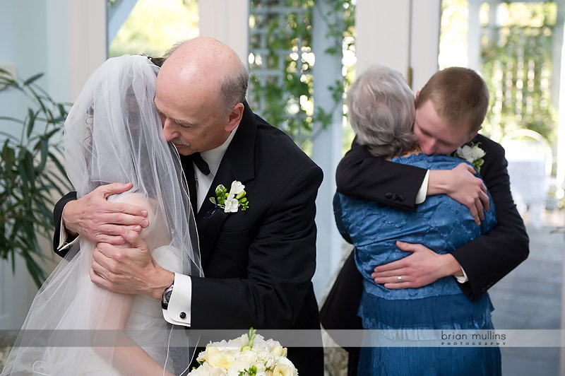 family congratulating bride and groom