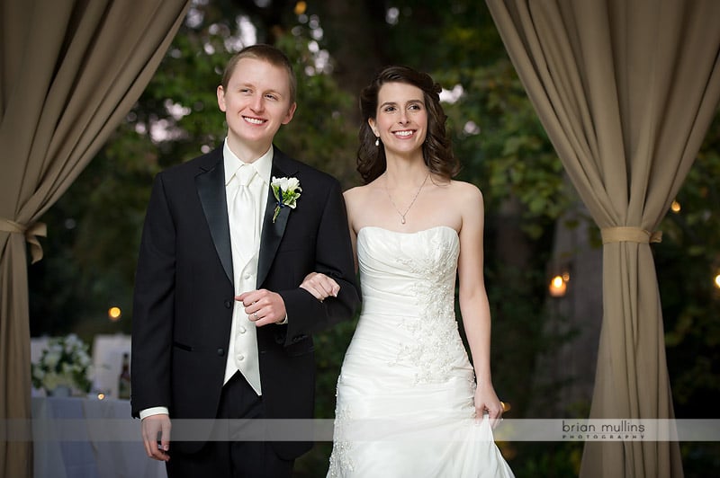 bride and groom entering wedding reception