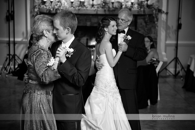 bride and groom dancing with parents